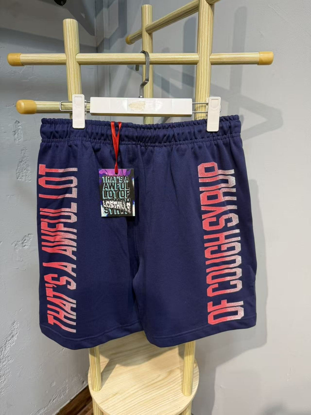 THAT'S A AWFUL LOT OF COUGH SYRUP Navy Graphic Shorts — back